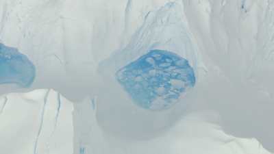 Small blue  lakes in the ice