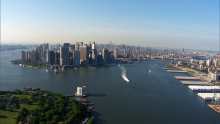 Wide shots of the City's setting, Manhattan, the Statue of Liberty