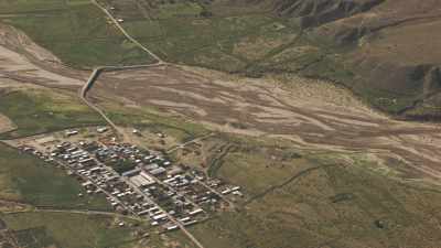 Small village in a fertile valley,   mountains