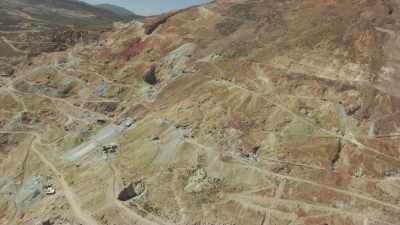 Silver mines, miners and city in the background