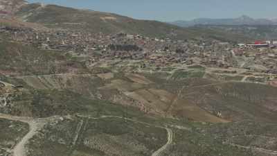 Flight over the city, the mine in the background