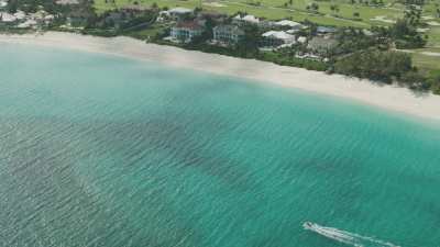 Golf course and uxurious house estate on the shore, lighthouse