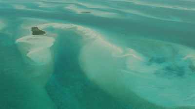 Sandbars and small islands appear