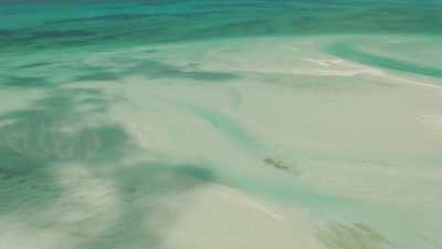 Shallow green waters, sandbars