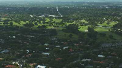 Flight over green residential areas,houses