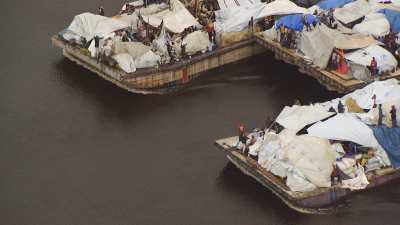 A huge overloaded commercial barge