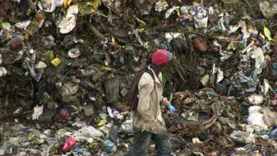 Men searching the garbage dump