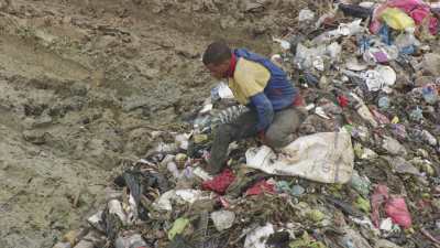 Men searching the garbage dump