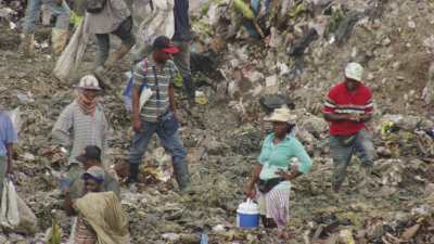 Men searching the garbage dump