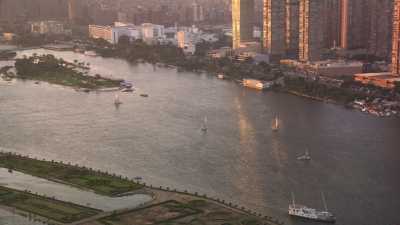 The Nile's shores, the city and sailboats in the evening sunlight