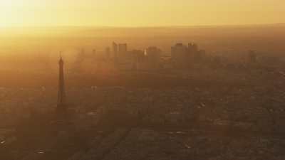 Misty golden sunset on the city and around the Eiffel Tower