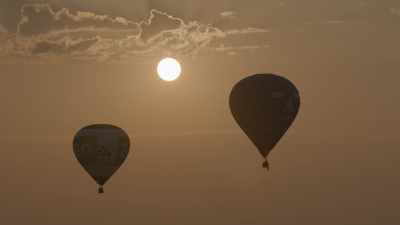 Air balloons move away at sundawn