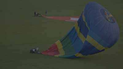 Air balloons landing in fields