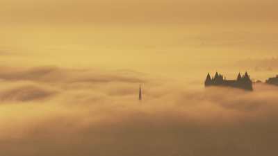 Castle and city of Saumur in the morning fog