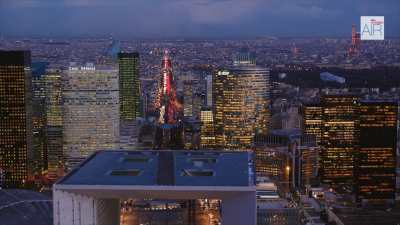 The business district of Paris La Defense with the Triumphal Way by night, from Nanterre up to Paris