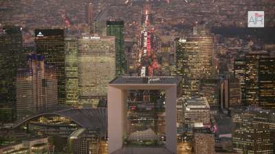 The business district of Paris La Défense by dusk with the Triumphal Way