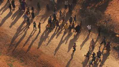 Children run  when seing helicopter, Kambioos Camp