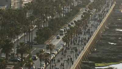 The Corniche,walkers and the beach