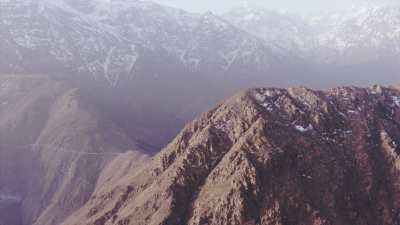 Snow capped mountains and villages near Tacheddirt