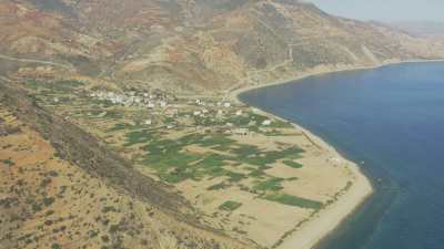 Mountains, cultures, and mosque on the beach near the village of Almarsa Ighaniman