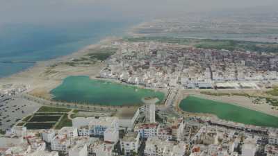 Close-ups of Martil and Miramar beach, the many bathers, parasols, pedal boats