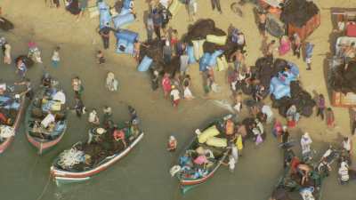 Small red seaweed fishing boats near Sidi El Abed beach