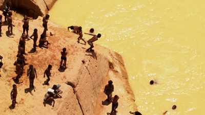 Children swimming in polluted waters