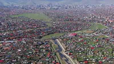 Ulaanbaatar suburbs and its yurts spread in the steppe