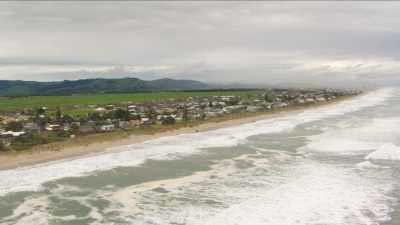 Wide shots of sea shore after the ship wreck