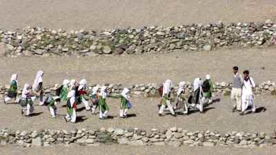 Children walking to school in the valley