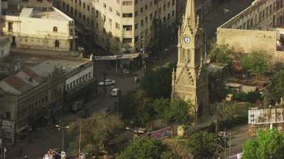 Flight over the city, bell tower and Mosque