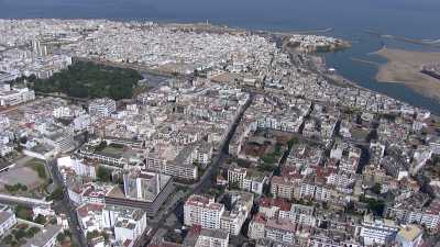 Flight over the coastal city, hotels and beaches