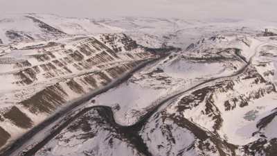 Abandonned buildings and open pit mine