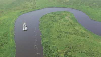 Barge loaded with piled up equipment on the Nile