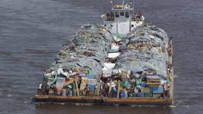 Barge loaded with piled up equipment on the Nile