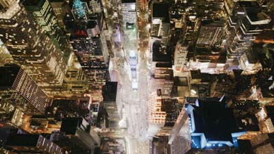 Vertical and spectacular night flight amongTimes Square skyscrapers