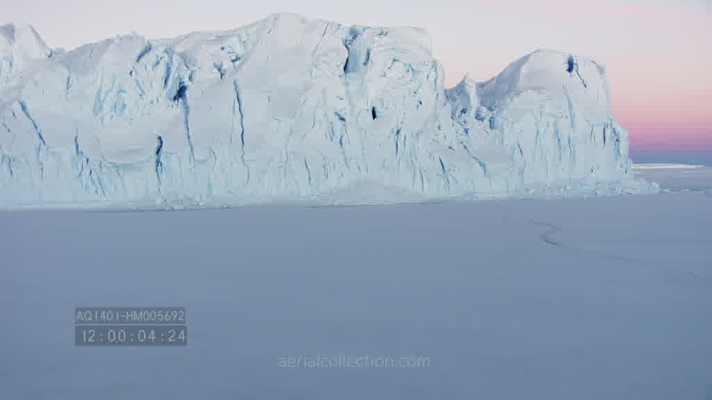 Spectacular flight through a canyon on the Astrolabe Glacier at dusk in summer.