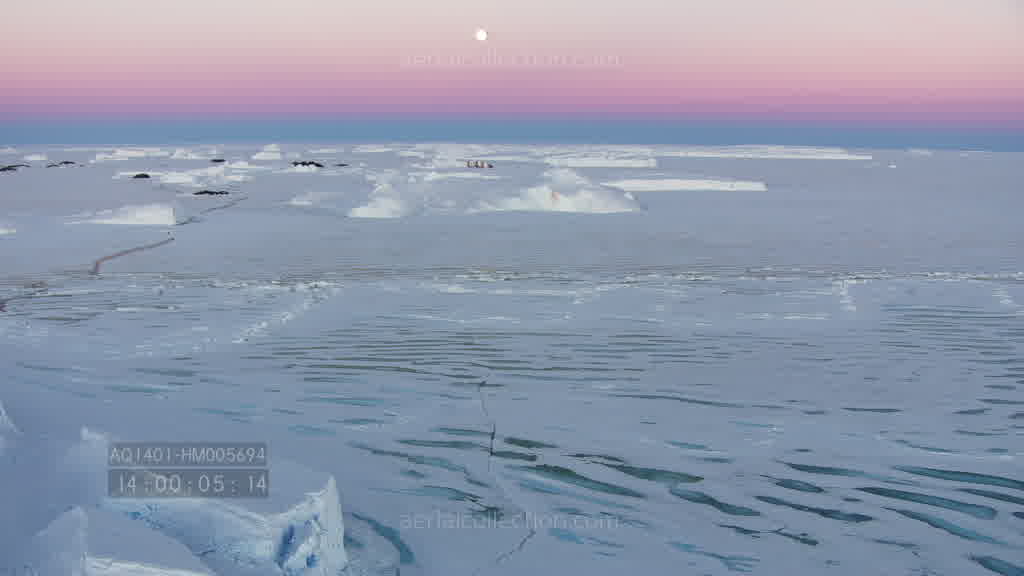 Spectacular flight through a canyon on the Astrolabe Glacier at dusk in summer.