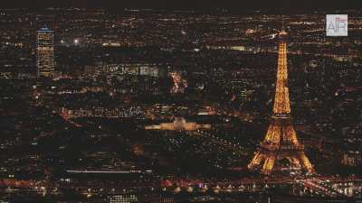 The Eiffel Tower by night in the cityscape of Paris