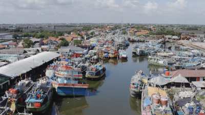 Fishing harbour and activities on the North shore of Java