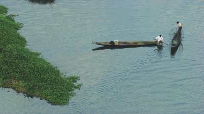 Fishermen in dugout canoes
