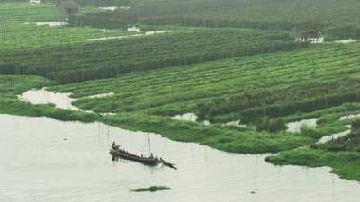 Monks in a dugout canoe