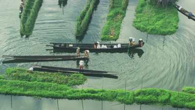 Fishermen and Farmers in Canoe